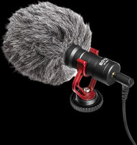 Microphone with a gray windscreen on a white background