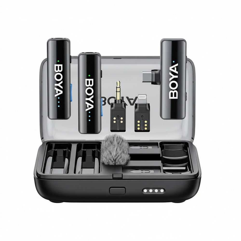 BOYALINK 2 wireless lavalier microphone set with various accessories including charging case, wind cover, and adapters displayed open on a table.