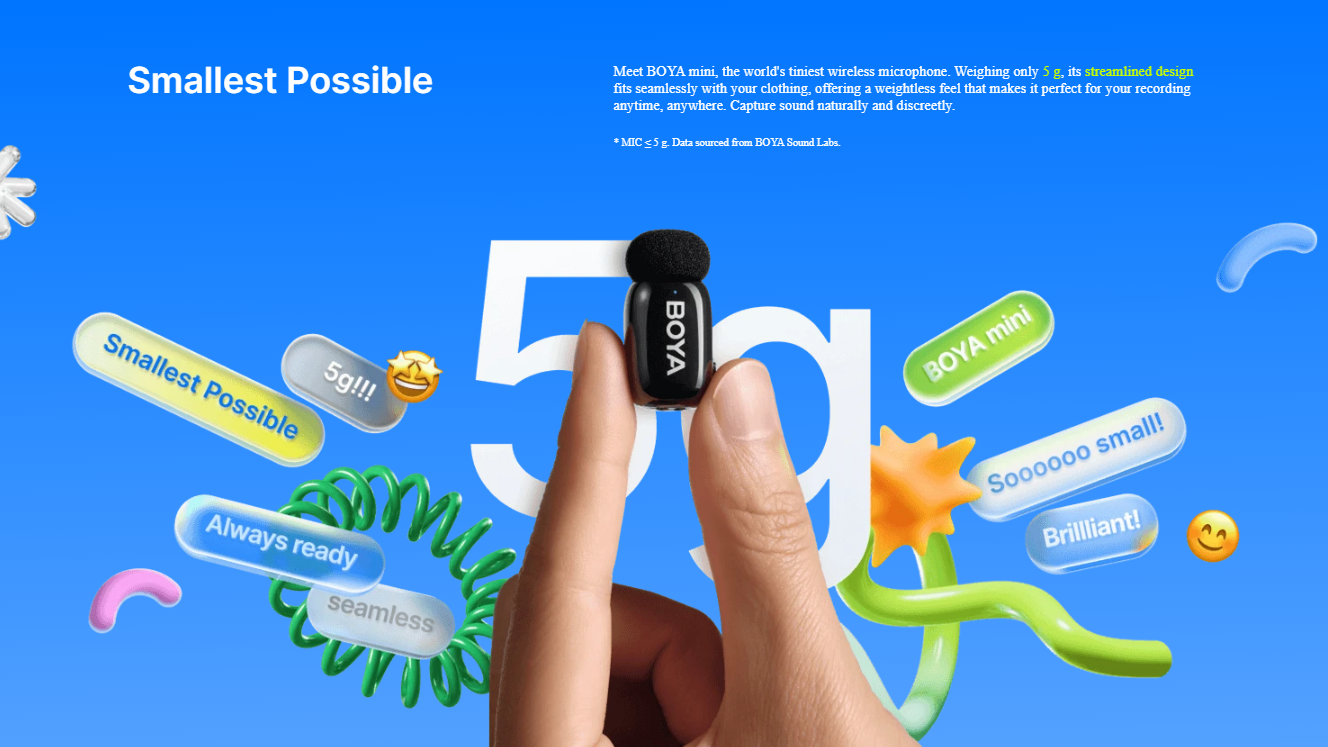 Small black device held between fingers against a blue background with colorful text and graphics.